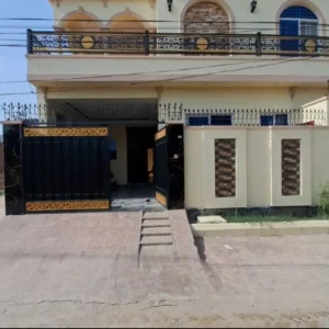 alt="Exterior of a 5 Marla double-storey house for sale on MPS Road near Mohsin Villas — clear boundary wall and main entrance visible."